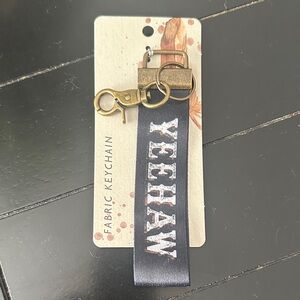 Maison Yeehaw Fabric Keychain - Black and Gold with white lettering.